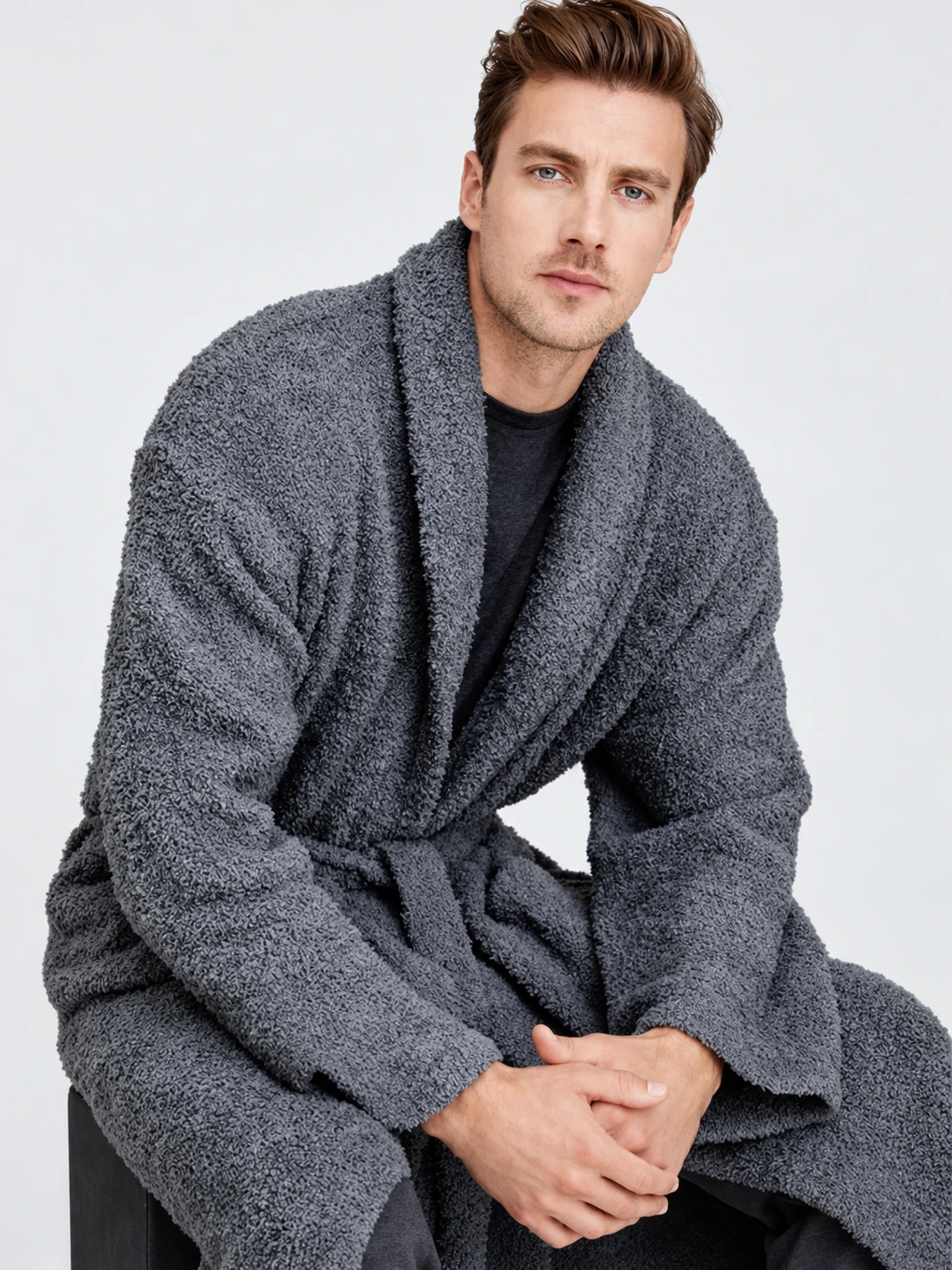 Man wearing a gray shawl-collar cardigan with a wrap front and textured knit