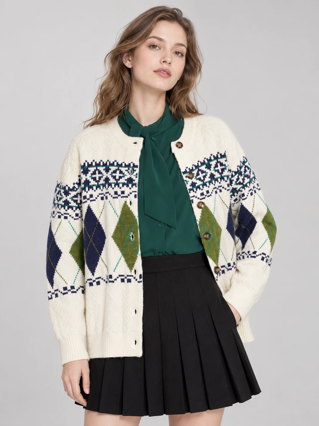Ivory button-front cardigan with green and navy argyle diamonds and small floral-pattern bands